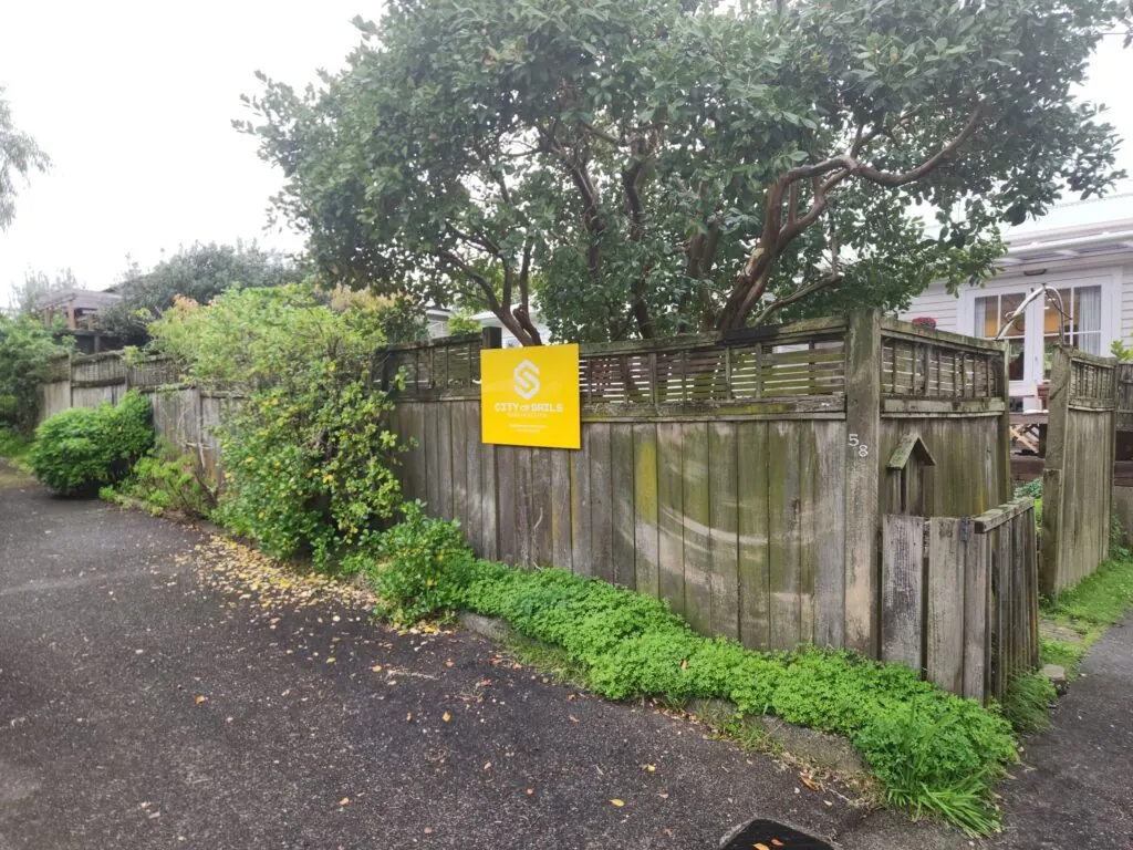 Before: Kwila vertical slat boundary fence in Avondale, West Auckland