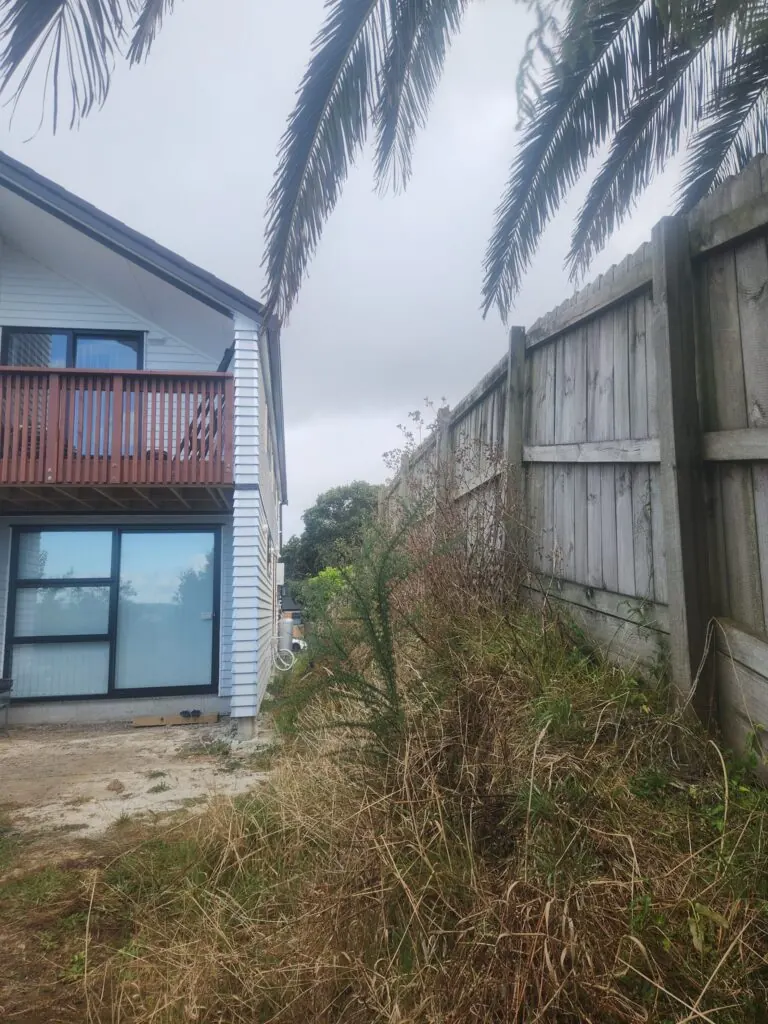 Before: Timber retaining wall and drainage in Massey, West Auckland