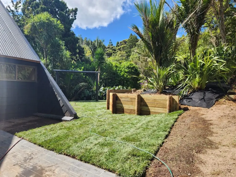 After: Timber retaining wall and ready lawn levelling in Titirangi, West Auckland
