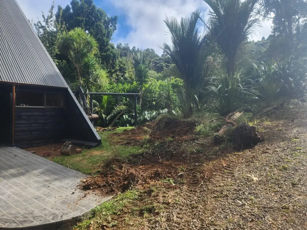 Before: Timber retaining wall and ready lawn levelling in Titirangi, West Auckland