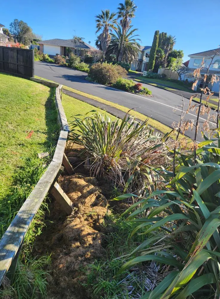 Before: Timber retaining wall renewal and drainage in Massey, West Auckland